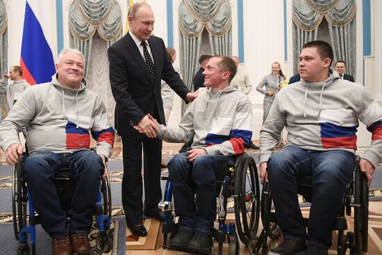 Russian President Vladimir Putin meets with Russian athletes - winners and medalists of 12th Paralympic Winter Games