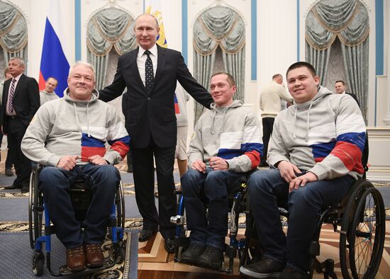 Russian President Vladimir Putin meets with Russian athletes - winners and medalists of 12th Paralympic Winter Games