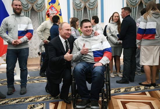 Russian President Vladimir Putin meets with Russian athletes - winners and medalists of 12th Paralympic Winter Games