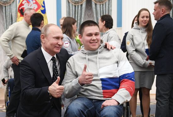 Russian President Vladimir Putin meets with Russian athletes - winners and medalists of 12th Paralympic Winter Games