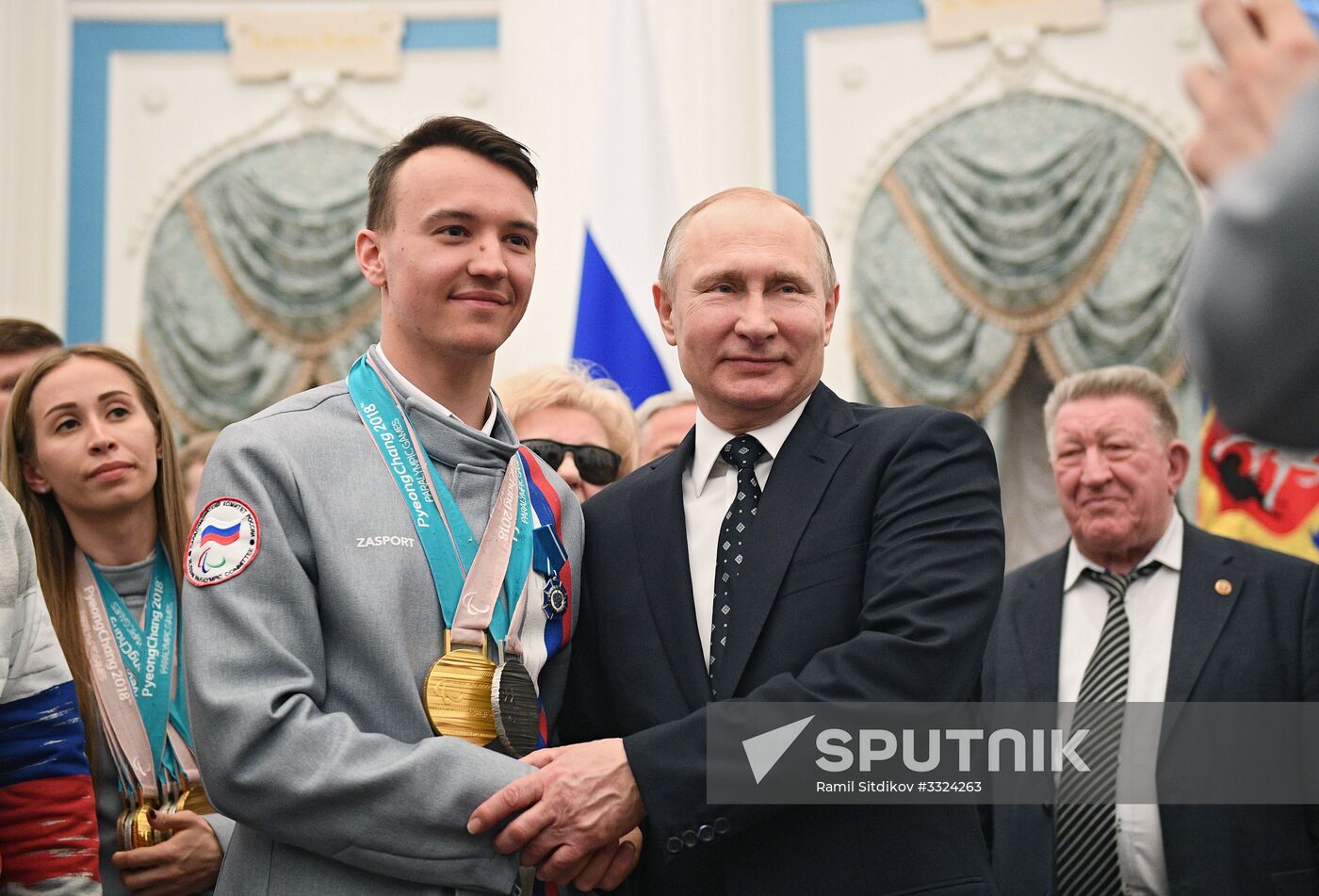 Russian President Vladimir Putin meets with Russian athletes - winners and medalists of 12th Paralympic Winter Games