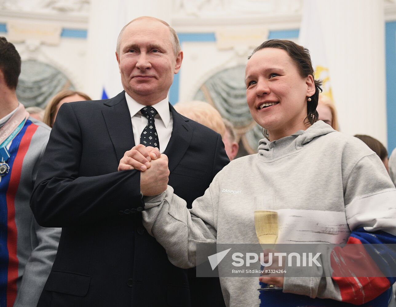 Russian President Vladimir Putin meets with Russian athletes - winners and medalists of 12th Paralympic Winter Games