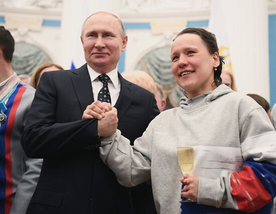 Russian President Vladimir Putin meets with Russian athletes - winners and medalists of 12th Paralympic Winter Games