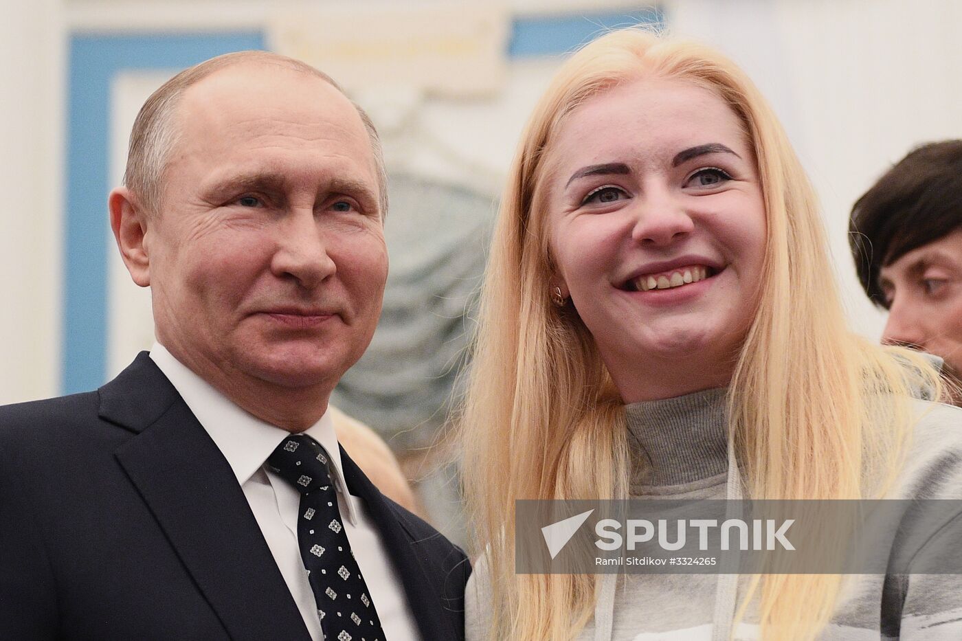 Russian President Vladimir Putin meets with Russian athletes - winners and medalists of 12th Paralympic Winter Games