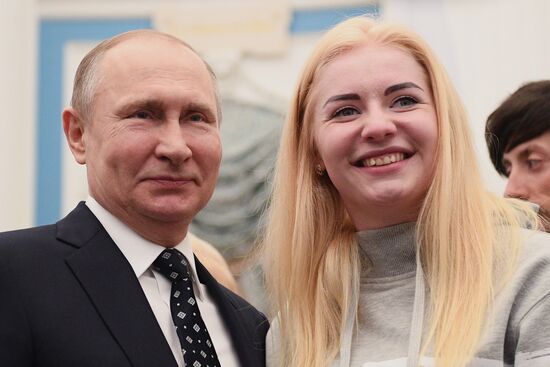 Russian President Vladimir Putin meets with Russian athletes - winners and medalists of 12th Paralympic Winter Games