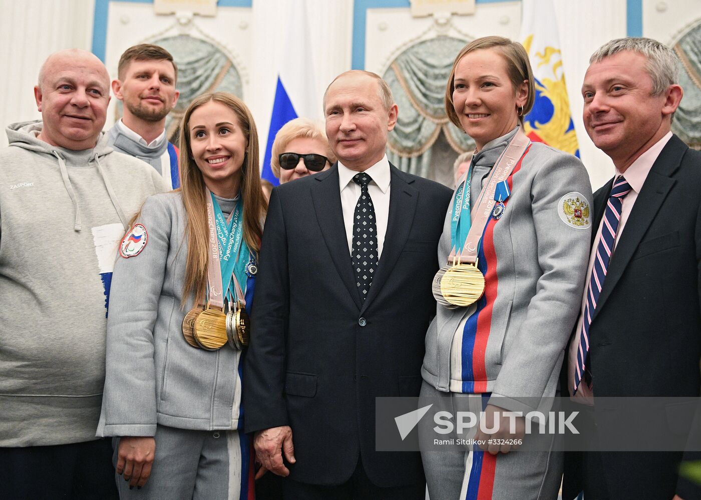 Russian President Vladimir Putin meets with Russian athletes - winners and medalists of 12th Paralympic Winter Games