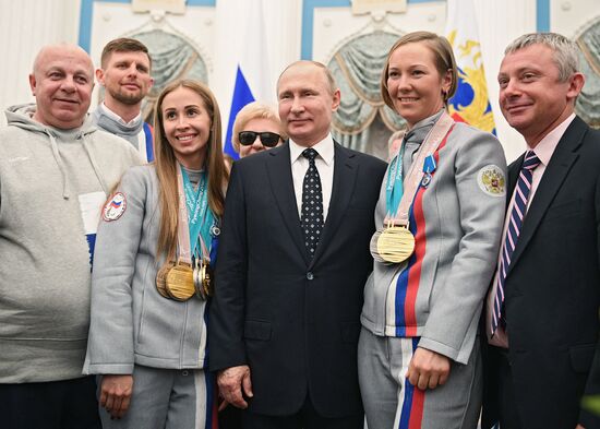 Russian President Vladimir Putin meets with Russian athletes - winners and medalists of 12th Paralympic Winter Games