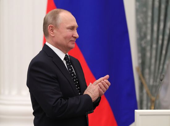 Russian President Vladimir Putin meets with Russian athletes - winners and medalists of 12th Paralympic Winter Games