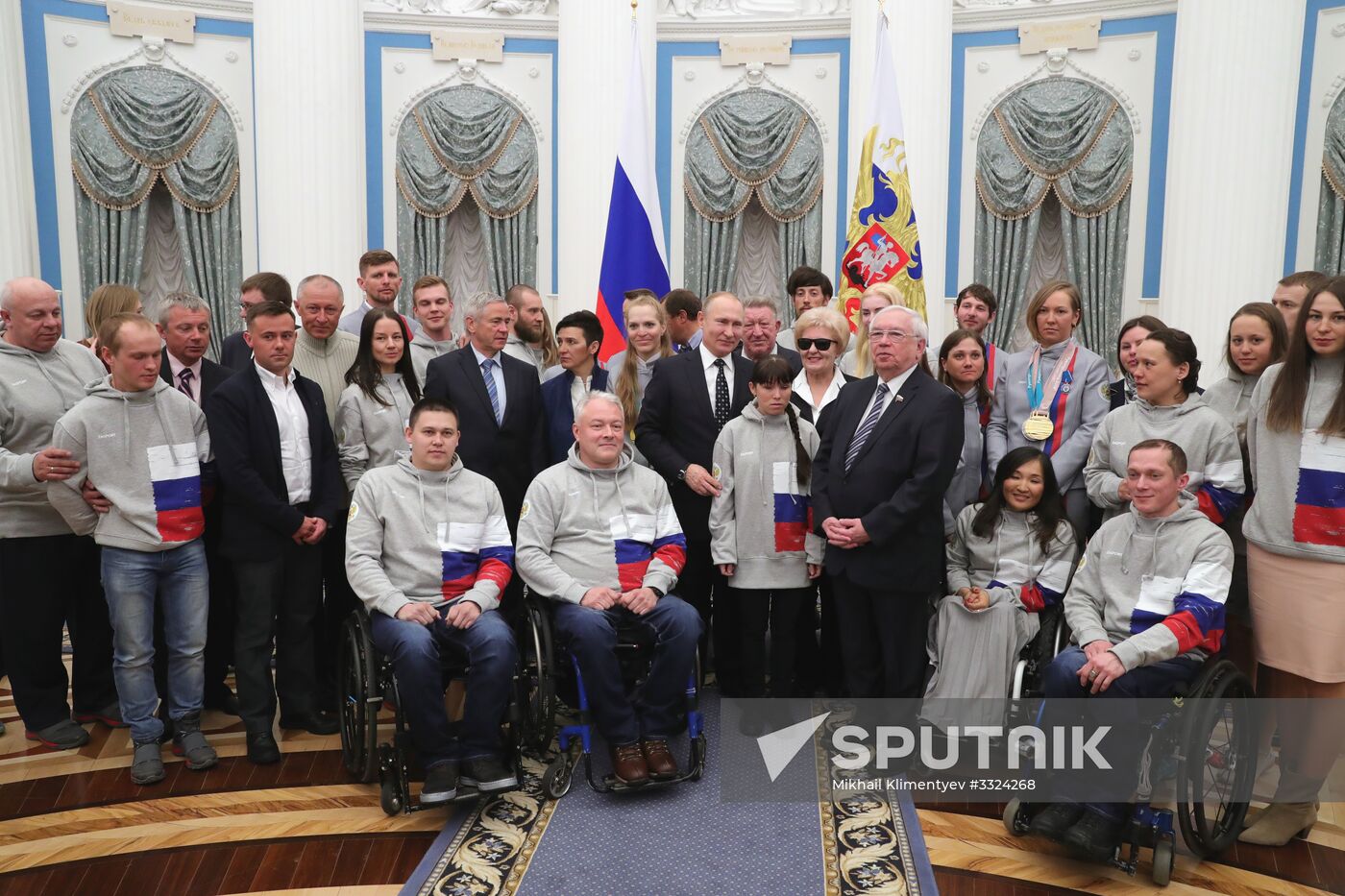 Russian President Vladimir Putin meets with Russian athletes - winners and medalists of 12th Paralympic Winter Games