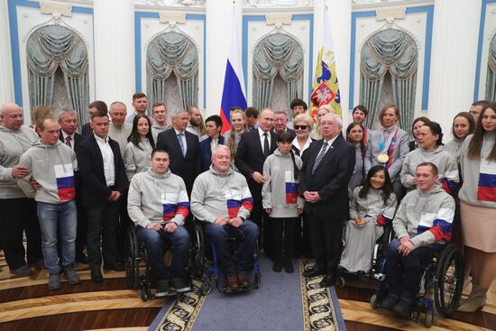 Russian President Vladimir Putin meets with Russian athletes - winners and medalists of 12th Paralympic Winter Games