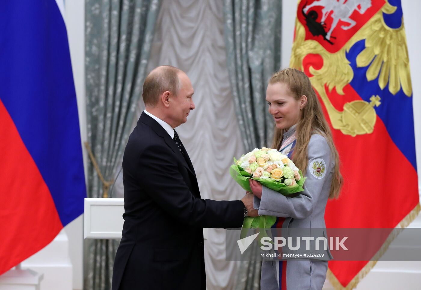 Russian President Vladimir Putin meets with Russian athletes - winners and medalists of 12th Paralympic Winter Games
