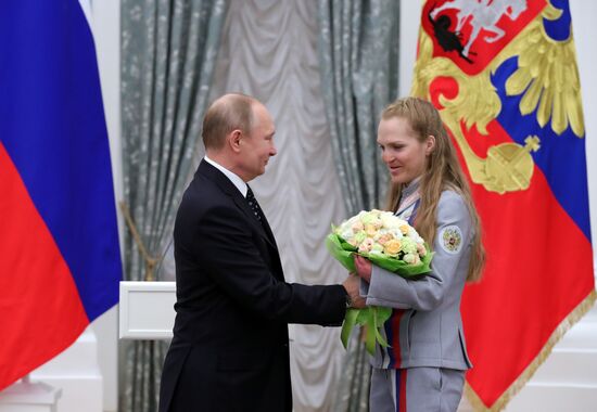 Russian President Vladimir Putin meets with Russian athletes - winners and medalists of 12th Paralympic Winter Games