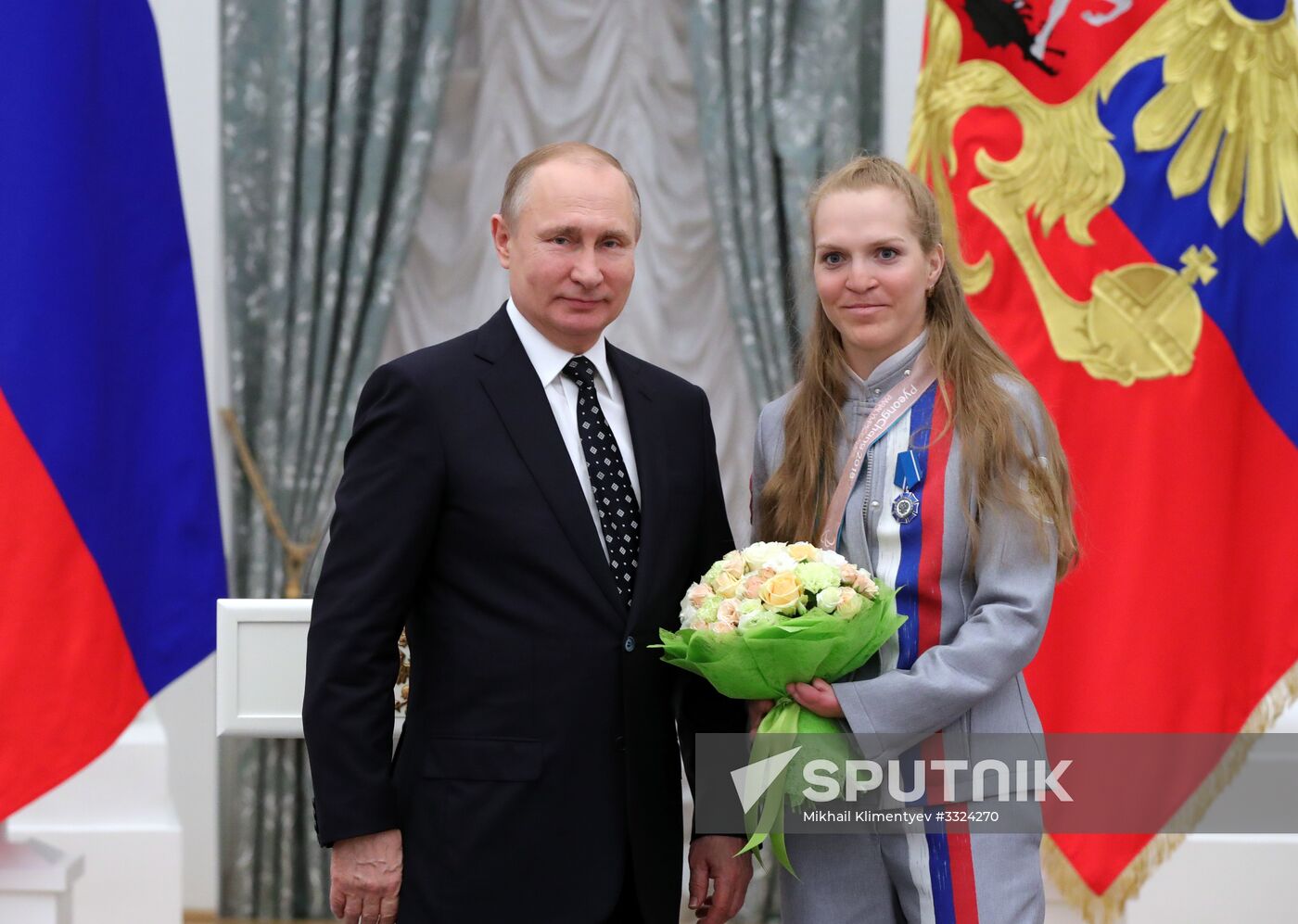 Russian President Vladimir Putin meets with Russian athletes - winners and medalists of 12th Paralympic Winter Games