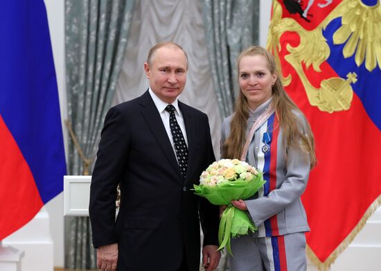 Russian President Vladimir Putin meets with Russian athletes - winners and medalists of 12th Paralympic Winter Games