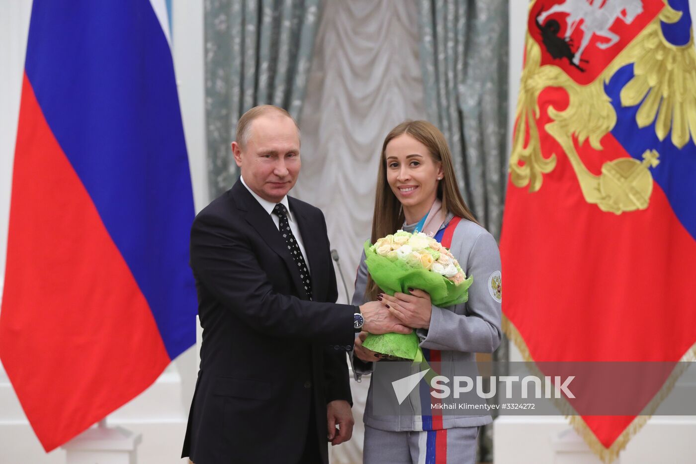 Russian President Vladimir Putin meets with Russian athletes - winners and medalists of 12th Paralympic Winter Games
