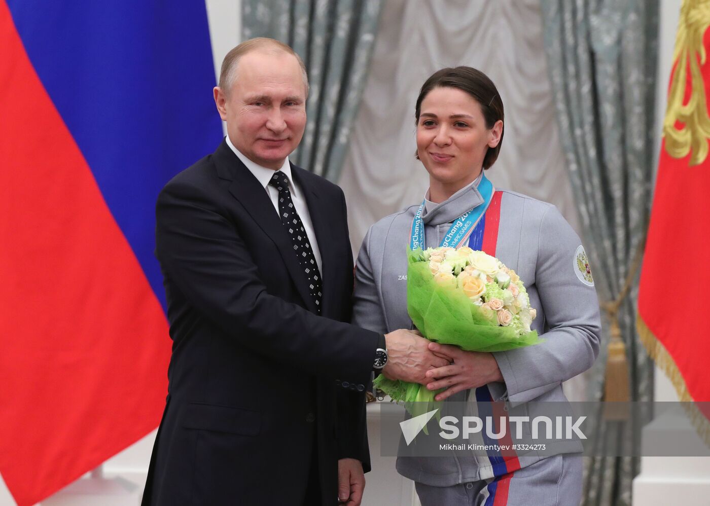 Russian President Vladimir Putin meets with Russian athletes - winners and medalists of 12th Paralympic Winter Games