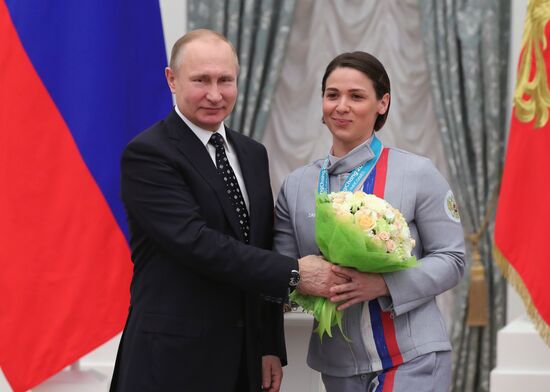 Russian President Vladimir Putin meets with Russian athletes - winners and medalists of 12th Paralympic Winter Games