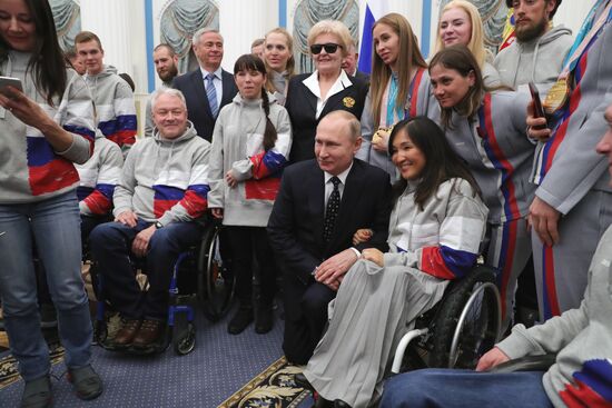 Russian President Vladimir Putin meets with Russian athletes - winners and medalists of 12th Paralympic Winter Games