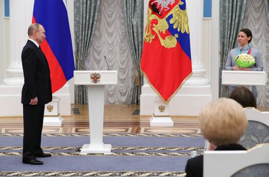 Russian President Vladimir Putin meets with Russian athletes - winners and medalists of 12th Paralympic Winter Games