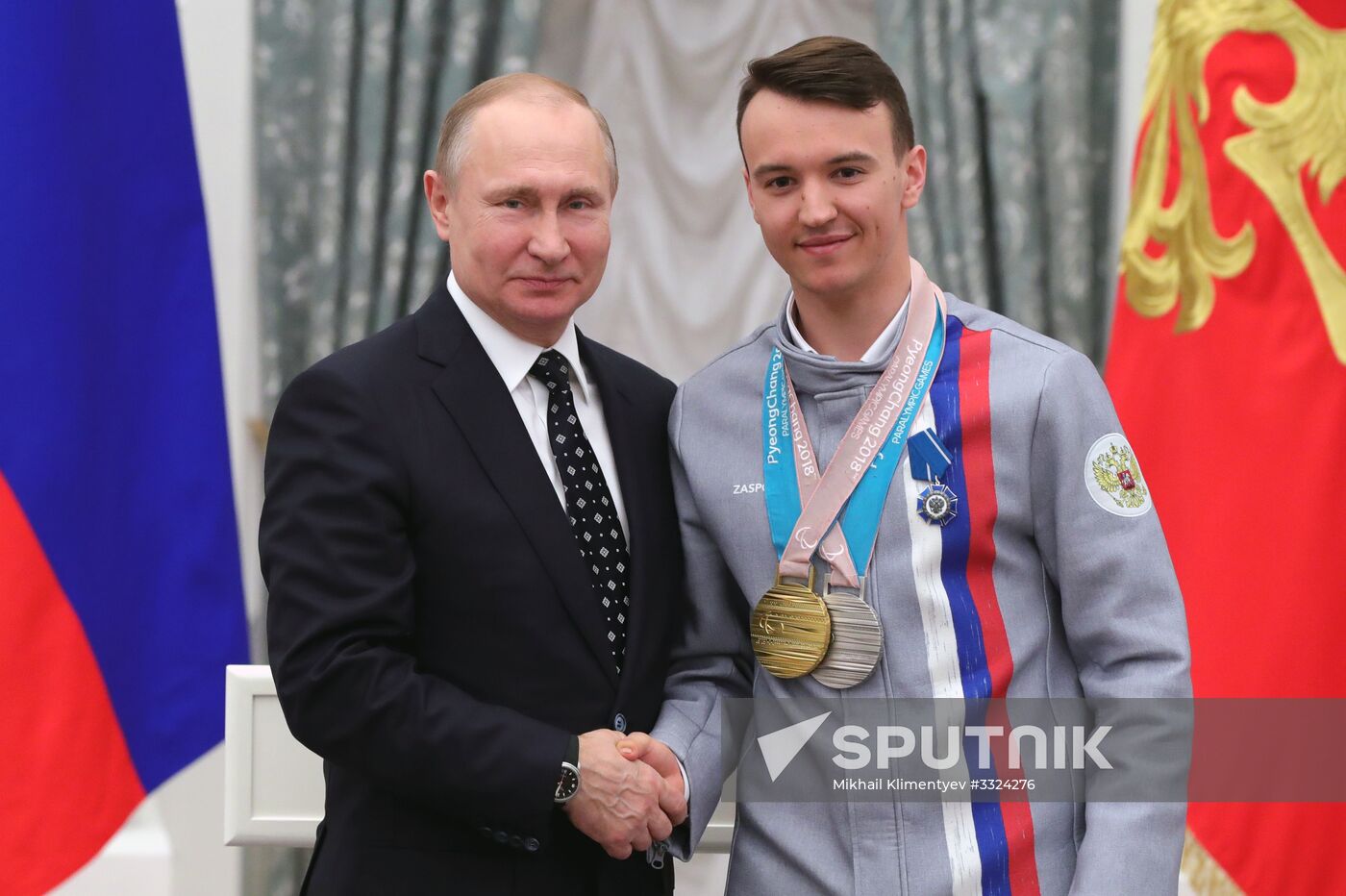 Russian President Vladimir Putin meets with Russian athletes - winners and medalists of 12th Paralympic Winter Games