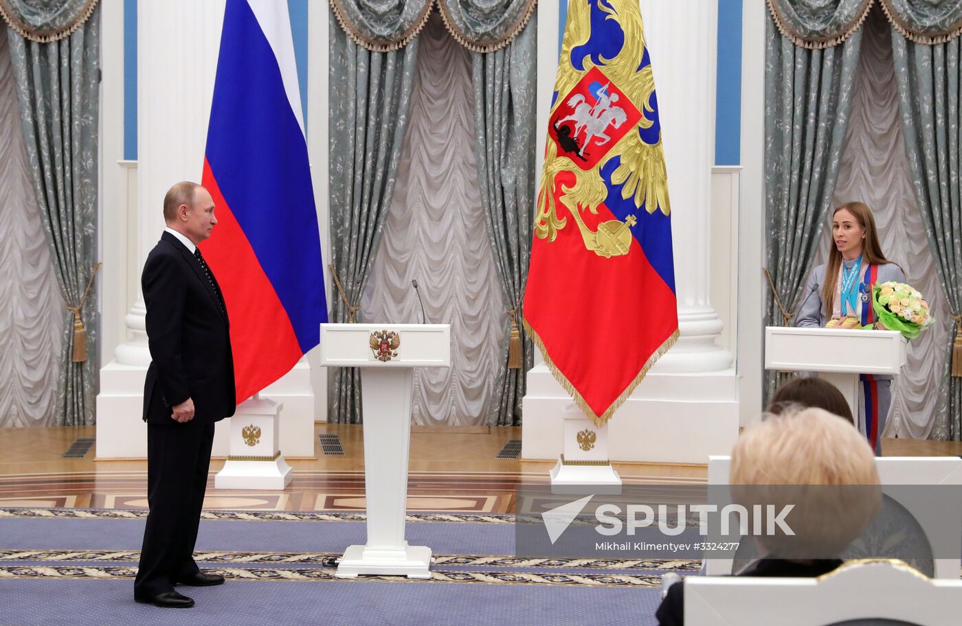 Russian President Vladimir Putin meets with Russian athletes - winners and medalists of 12th Paralympic Winter Games