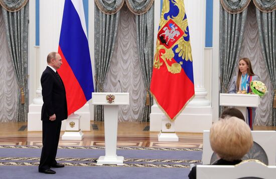 Russian President Vladimir Putin meets with Russian athletes - winners and medalists of 12th Paralympic Winter Games