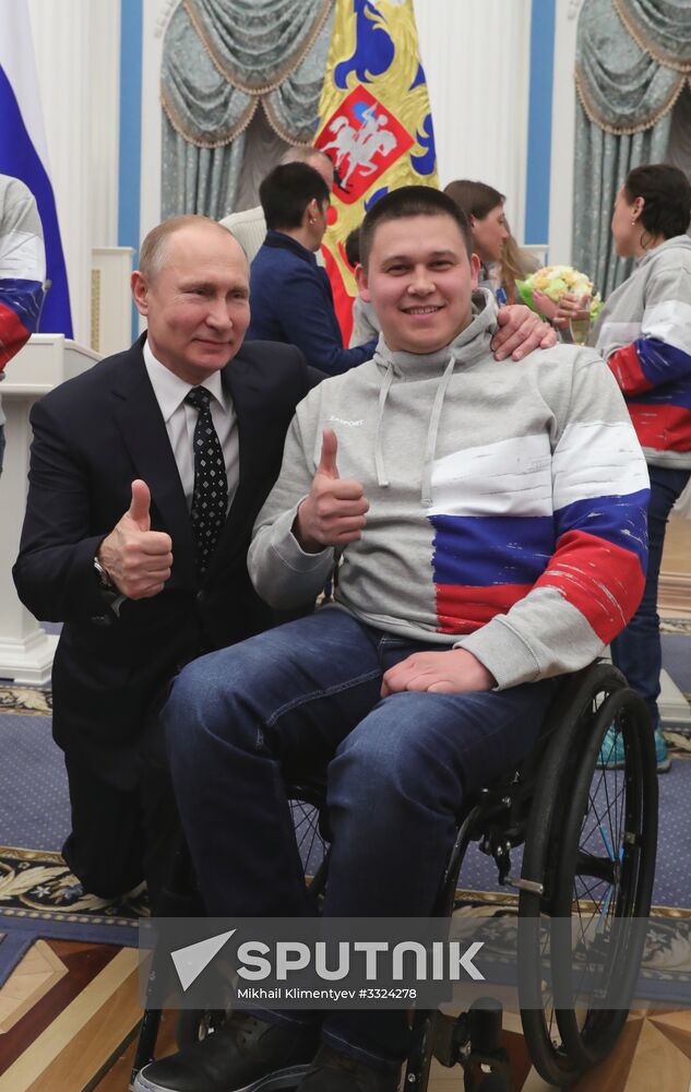 Russian President Vladimir Putin meets with Russian athletes - winners and medalists of 12th Paralympic Winter Games