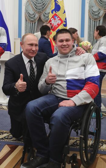 Russian President Vladimir Putin meets with Russian athletes - winners and medalists of 12th Paralympic Winter Games