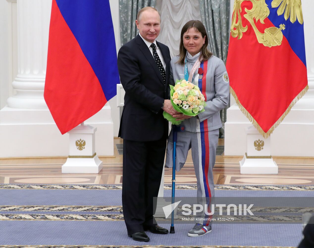 Russian President Vladimir Putin meets with Russian athletes - winners and medalists of 12th Paralympic Winter Games