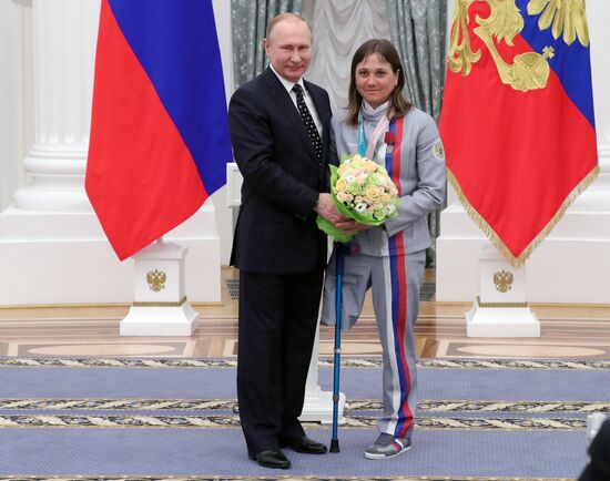 Russian President Vladimir Putin meets with Russian athletes - winners and medalists of 12th Paralympic Winter Games