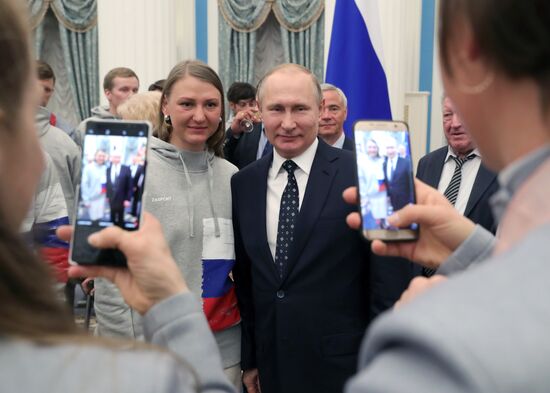 Russian President Vladimir Putin meets with Russian athletes - winners and medalists of 12th Paralympic Winter Games