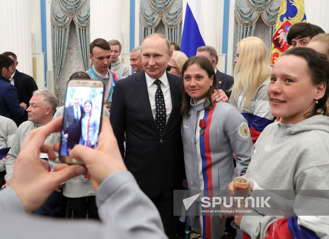 Russian President Vladimir Putin meets with Russian athletes - winners and medalists of 12th Paralympic Winter Games
