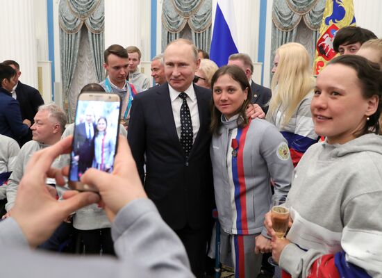 Russian President Vladimir Putin meets with Russian athletes - winners and medalists of 12th Paralympic Winter Games