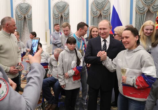 Russian President Vladimir Putin meets with Russian athletes - winners and medalists of 12th Paralympic Winter Games