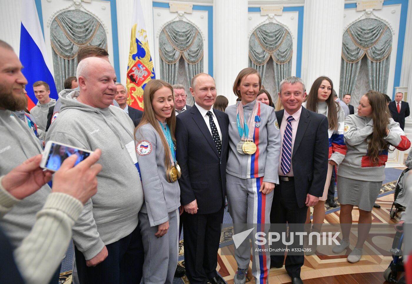 Russian President Vladimir Putin meets with Russian athletes - winners and medalists of 12th Paralympic Winter Games