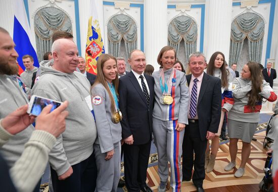 Russian President Vladimir Putin meets with Russian athletes - winners and medalists of 12th Paralympic Winter Games