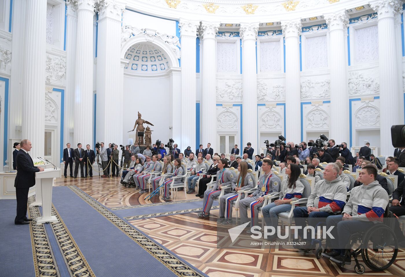 Russian President Vladimir Putin meets with Russian athletes - winners and medalists of 12th Paralympic Winter Games