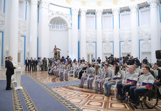 Russian President Vladimir Putin meets with Russian athletes - winners and medalists of 12th Paralympic Winter Games