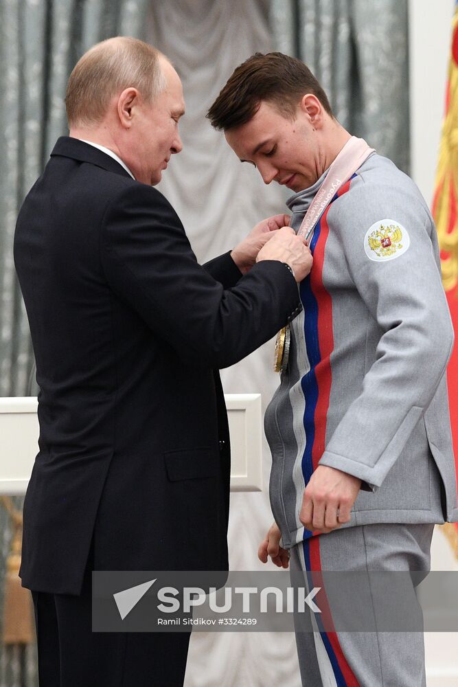 Russian President Vladimir Putin meets with Russian athletes - winners and medalists of 12th Paralympic Winter Games