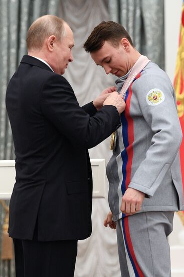 Russian President Vladimir Putin meets with Russian athletes - winners and medalists of 12th Paralympic Winter Games