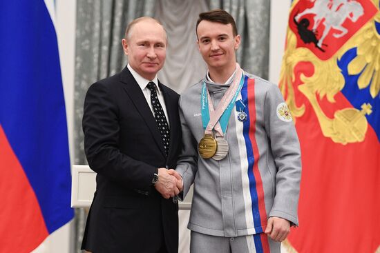 Russian President Vladimir Putin meets with Russian athletes - winners and medalists of 12th Paralympic Winter Games