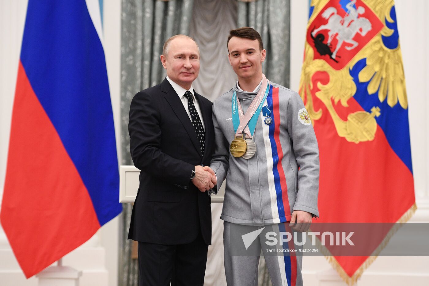Russian President Vladimir Putin meets with Russian athletes - winners and medalists of 12th Paralympic Winter Games