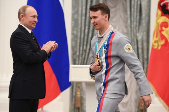 Russian President Vladimir Putin meets with Russian athletes - winners and medalists of 12th Paralympic Winter Games