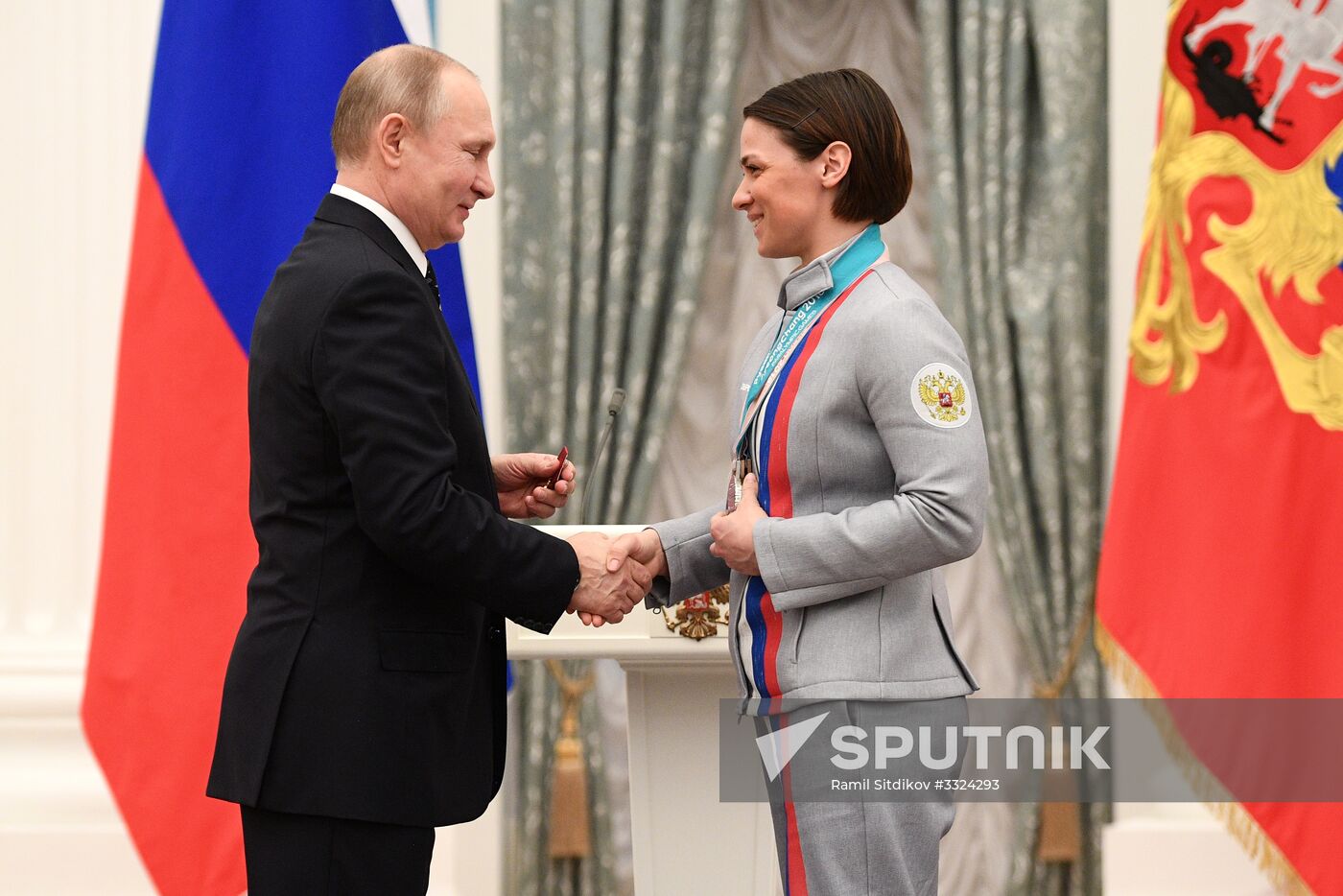Russian President Vladimir Putin meets with Russian athletes - winners and medalists of 12th Paralympic Winter Games