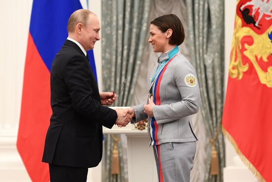 Russian President Vladimir Putin meets with Russian athletes - winners and medalists of 12th Paralympic Winter Games