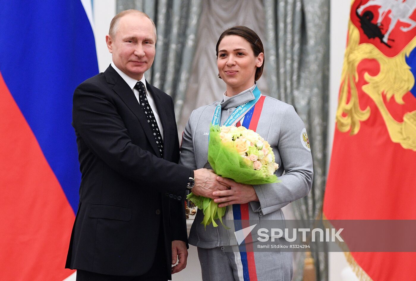 Russian President Vladimir Putin meets with Russian athletes - winners and medalists of 12th Paralympic Winter Games