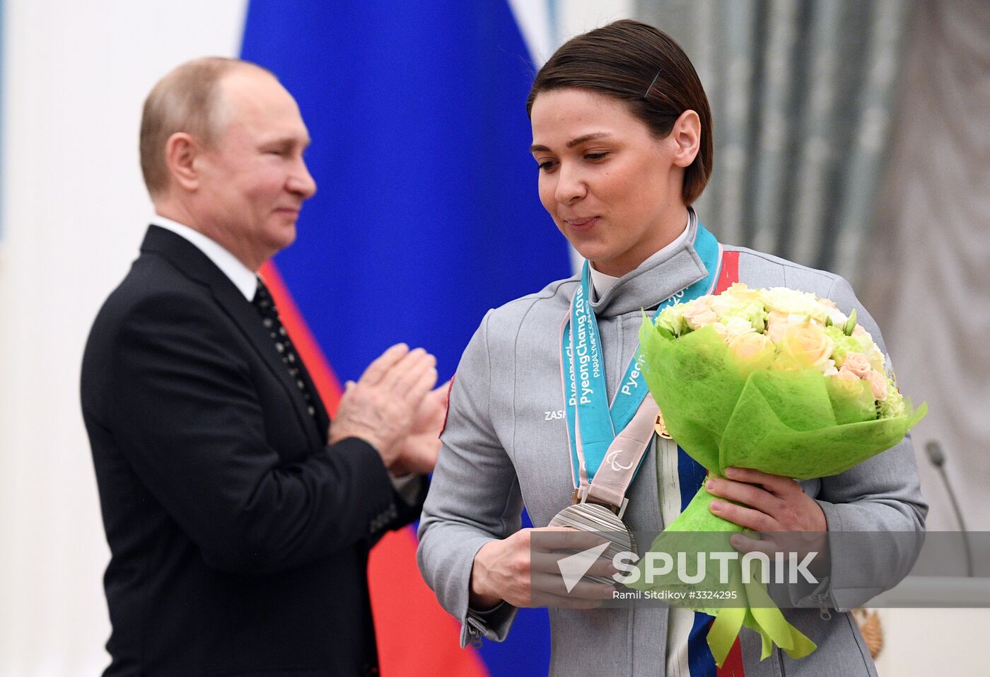Russian President Vladimir Putin meets with Russian athletes - winners and medalists of 12th Paralympic Winter Games