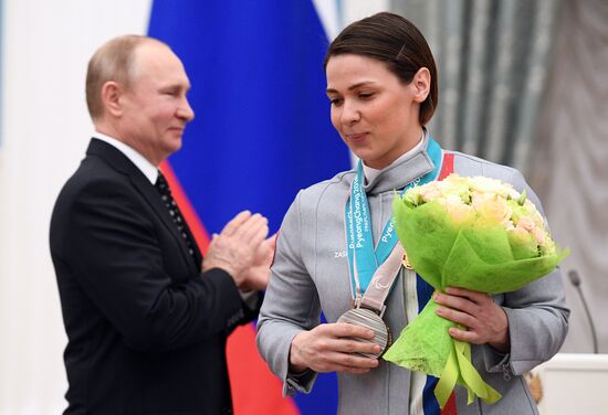 Russian President Vladimir Putin meets with Russian athletes - winners and medalists of 12th Paralympic Winter Games