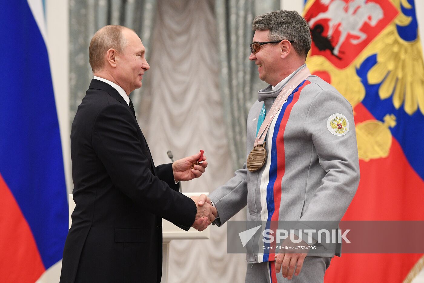 Russian President Vladimir Putin meets with Russian athletes - winners and medalists of 12th Paralympic Winter Games