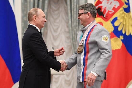 Russian President Vladimir Putin meets with Russian athletes - winners and medalists of 12th Paralympic Winter Games